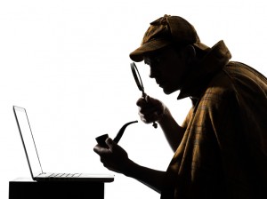 sherlock holmes inspecting computer keyboard