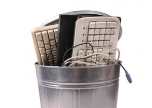 bucket of wired keybarods trash